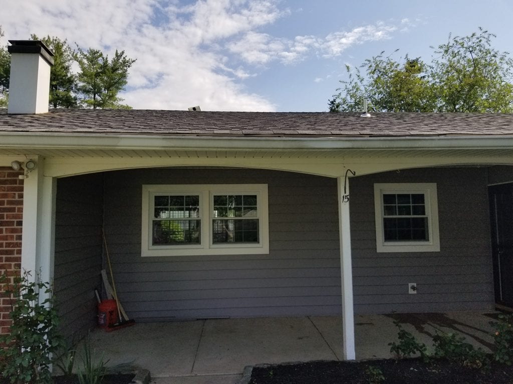 Certainteed cedar plank vinyl siding and custom cut arches under porch overhang by markey windows doors and more