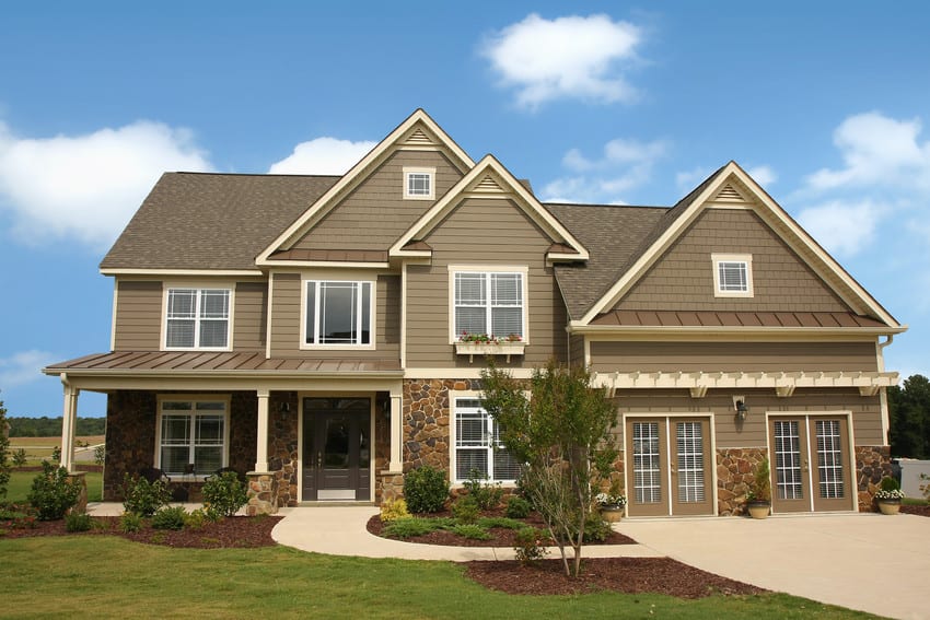 Beautiful Colonial with HardiePlank siding and white Vinyl replacement windows