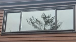 brown sides of house and black window