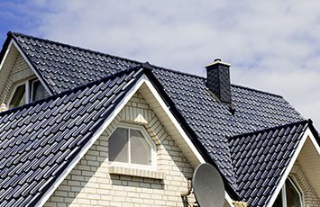 white-home-withblack-roofing