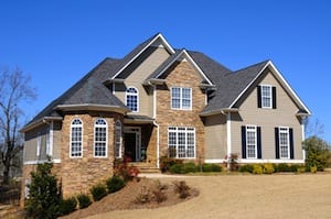 beautiful home with grey roofing